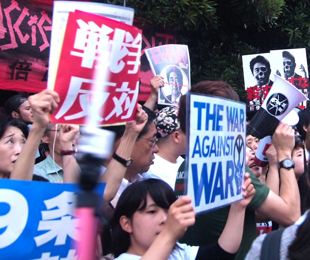 Protesters oppose Against Abe's Move to Reinterpret Japan's Pacifist Constitution in 2014 (photo credit: Natsuki Kimura-Flickr)