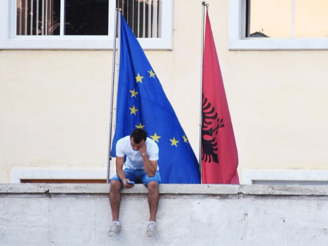 EU and Albanian flags side by side (Photo credit: BIRN/Ivana Dervishi)