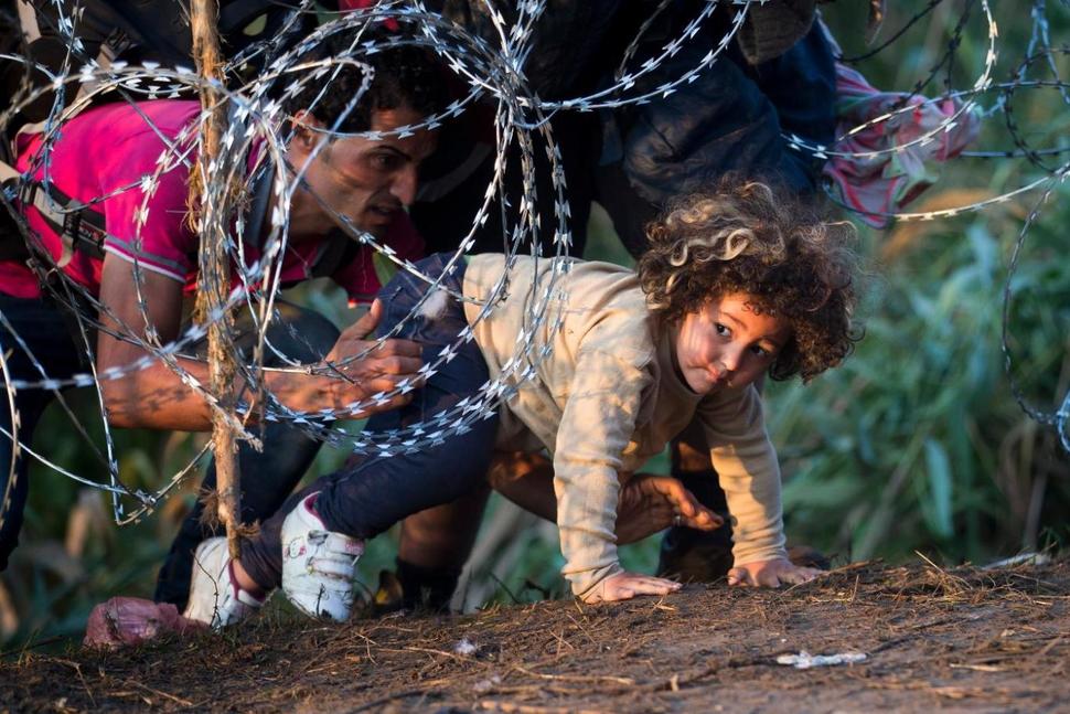 Child crossing from Serbia to Hungary (photo credit: AP Photo/Darko Bandic)