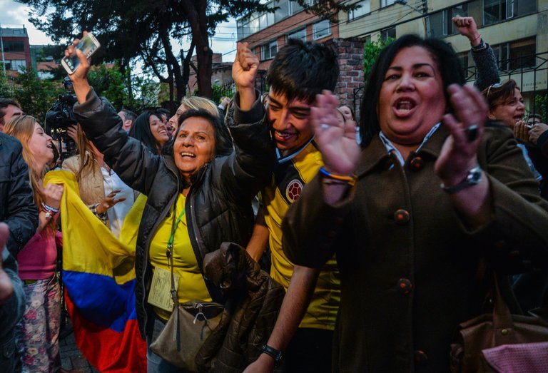 Opponents of the Colombian peace agreement celebrating on Sunday in Bogotá, the capital, after the results of a national referendum were announced (photo credit: Credit Diana Sanchez/Agence France-Presse — Getty Images)