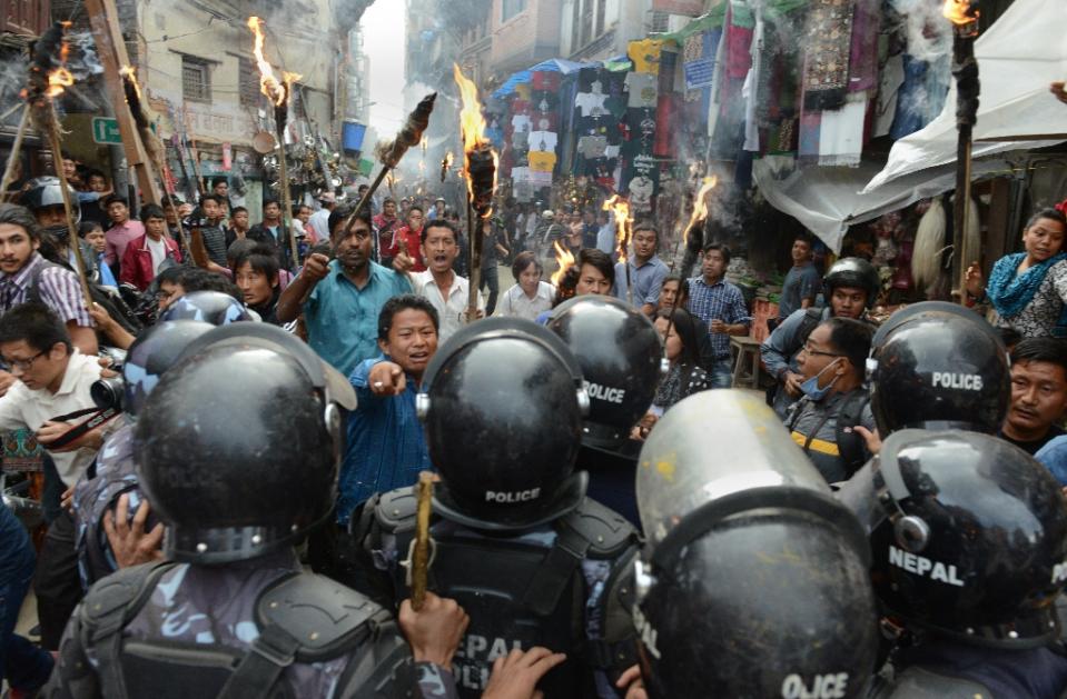 Nepalese police clash with supporters of opposition political parties during a protest against a draft constitution in Kathmandu on August 15, 2015. [photo credit: Prakash Mathema/AFP/Getty Images]