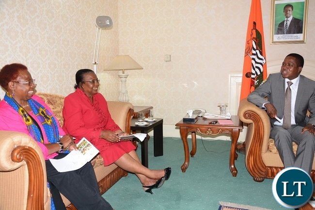President Edgar Lungu speaks to NGOCC member of board of trustee Dorothy Hamwele (c) and NGOCC chairperson Sarah Longwe at State House (photo credit: Lusaka Times)