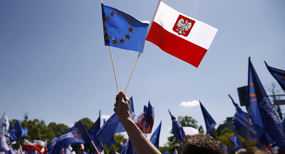 EU and Polish flags (photo credit: Reuters/Kacper Pempel)