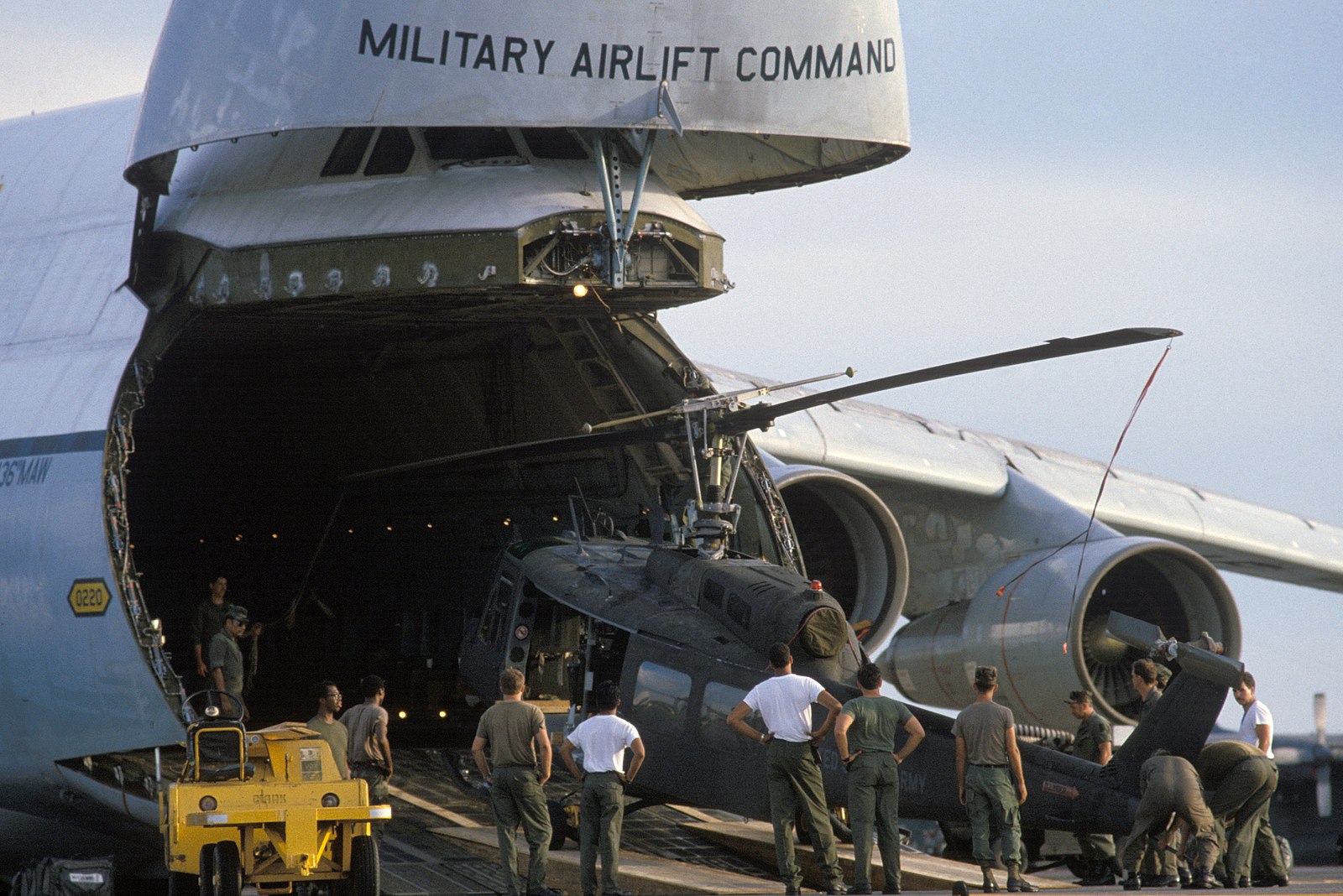Air Force personnel load an Army UH-1H Iroquois helicopter into a 436th Military Airlift Wing C-5A Galaxy aircraft for transport to Ecuador (credit: Digital Public Library of America via Wikimedia Commons) Air Force personnel load an Army UH-1H Iroquois helicopter into a 436th Military Airlift Wing C-5A Galaxy aircraft for transport to Ecuador (credit: Digital Public Library of America via Wikimedia Commons)