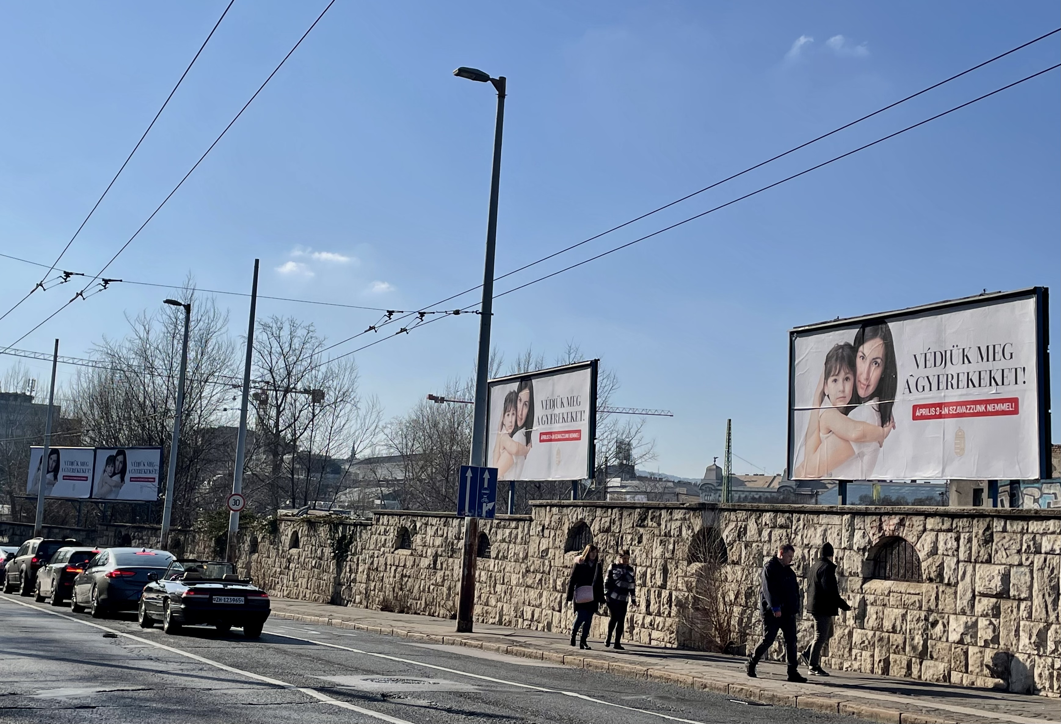 Hungarian government campaign posters line the streets, urging voters to "protect the children" in the upcoming referendum (photo credit: Renáta Uitz)