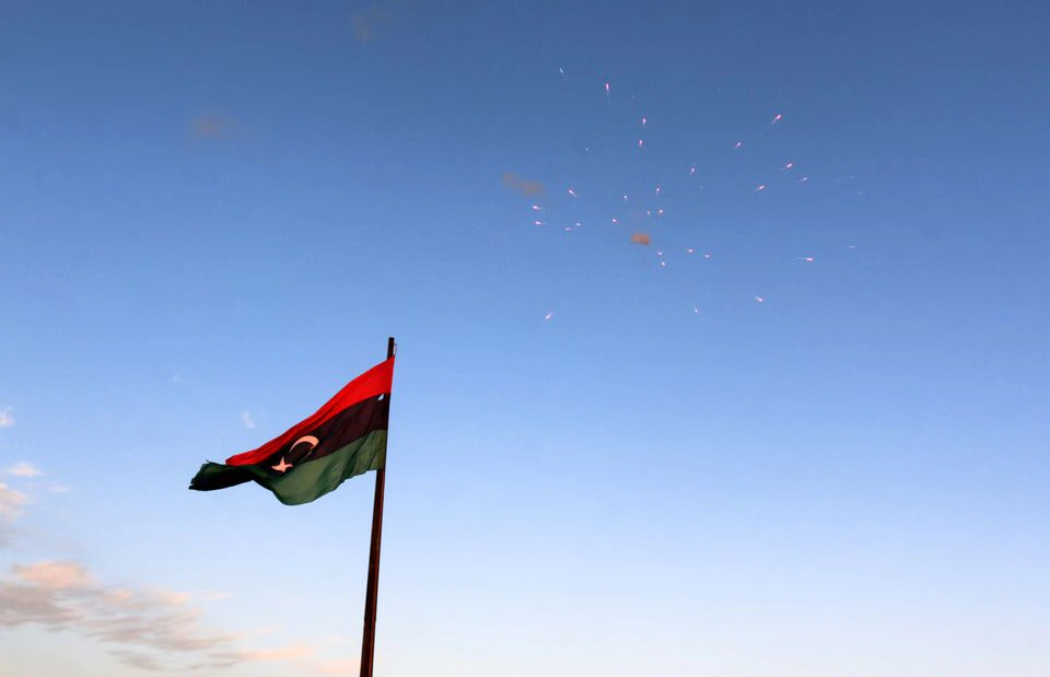 Flag of Libya (photo credit: Reuters / Hani Amara)