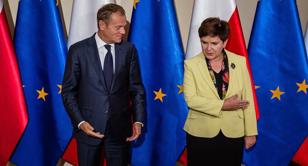 Former Polish PM and current president of European Council with current Polish PM (photo credit: AFP / Wojtek Radwanski  