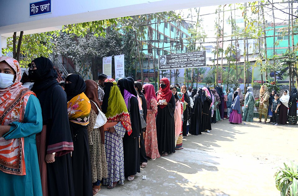 Voters lining at polling station to cast their ballots for the 13th National Parliament Election and the 2026 Referendum (credit: Press Information Department of Bangladesh via Wikimedia Commons)
