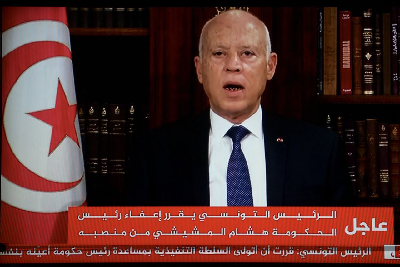 Tunisian President Kais Saied announcing the dismissal of the Prime Minister and suspension of parliament on 25 July 2021 (photo credit:  Fethi Belaid via AFP)