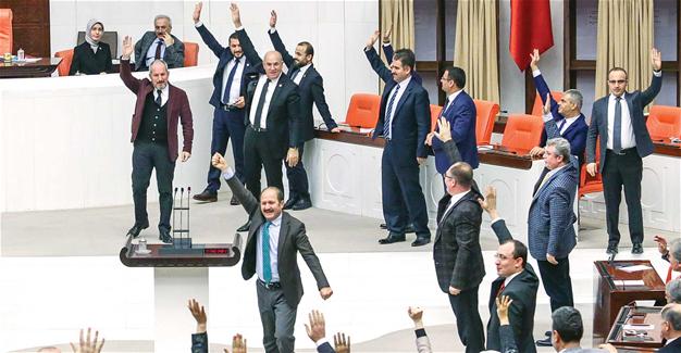 MPs of the ruling AKP party celebrate the approval of the amendments (photo credit: Hurriyet Daily News)