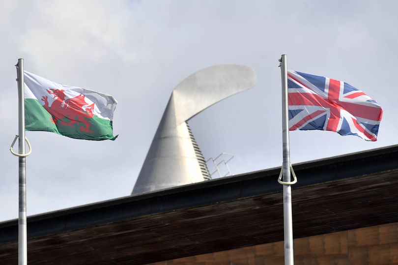 Welsh and UK flag at the Senedd (photo credit: North Wales Live)