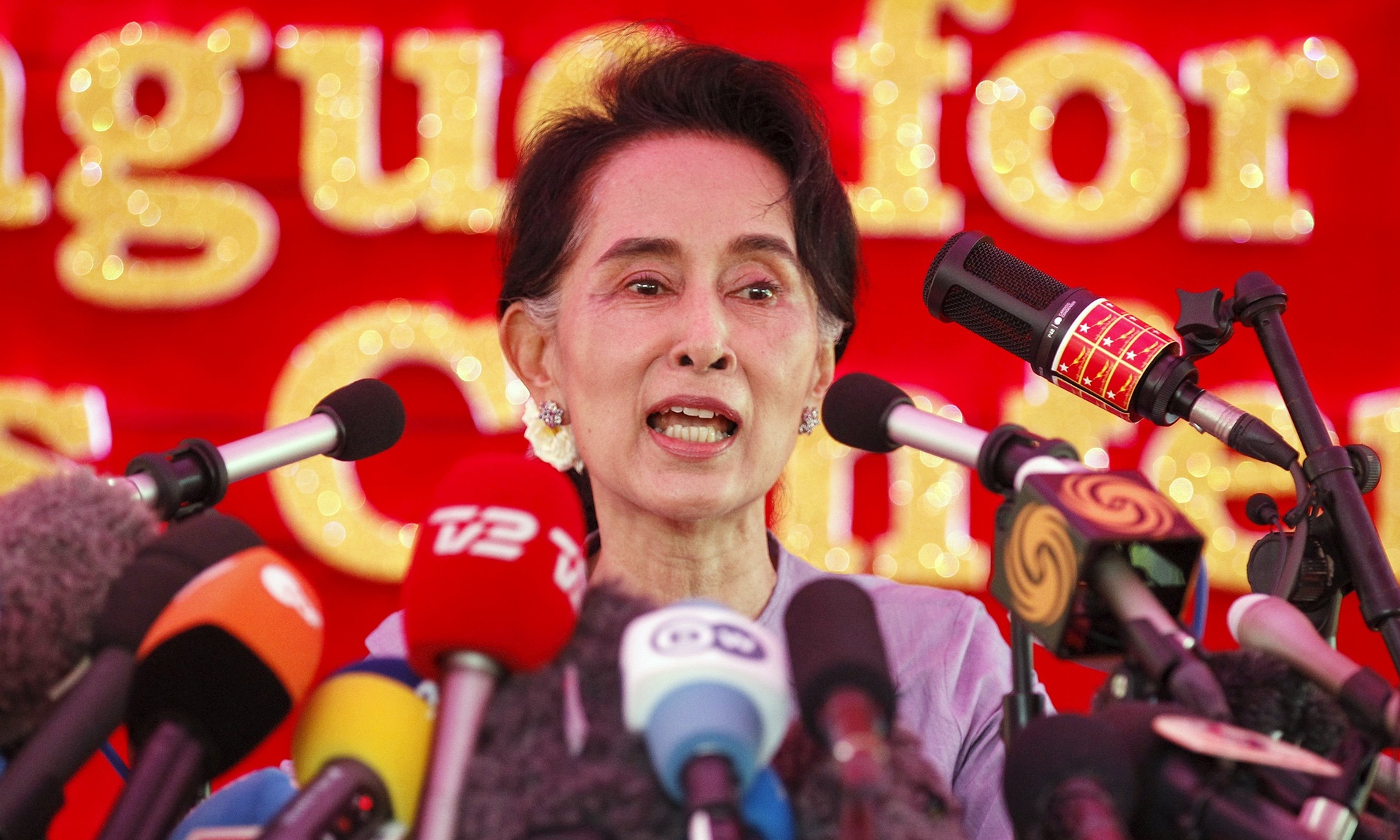 Aung San Suu Kyi speaks to media about the upcoming general elections, during a news conference at her home in Yangon on Thursday. (Photo credit: Soe Zeya Tun/Reuters)