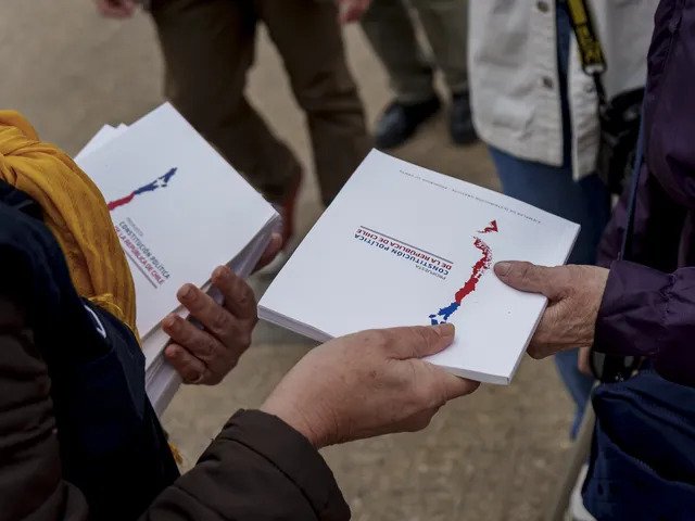 Constitutional drafts handed out in anticipation of referendum vote (photo credit: Sebastián Vivallo Oñate/Agencia Makro/Getty Images)