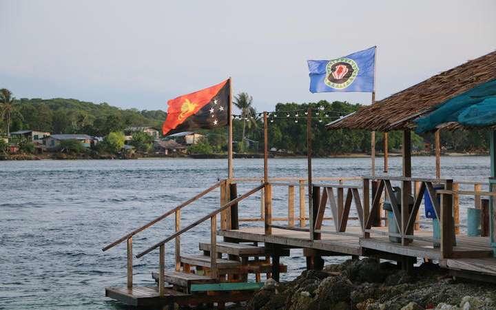 Flags of PNG and Bougainville (photo credit: RNZ / Johnny Blades)
