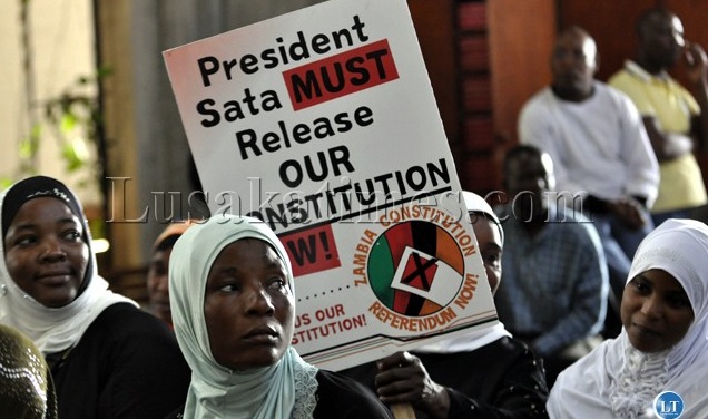 Zambian muslim Women raise a placard during gathering demanding release of the draftConstitution; C/Flickr/LT