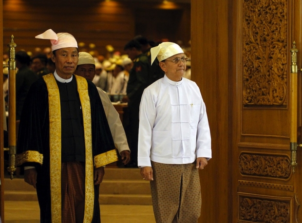 Shwe Man (L), Speaker of the Union Parliament, and Myanmar"s President Thein Sein exit after he gave a speech at the regular 9th section of the Union parliament on the final day in Nyapyitaw in this March 26, 2014 [photo credit: Reuters]