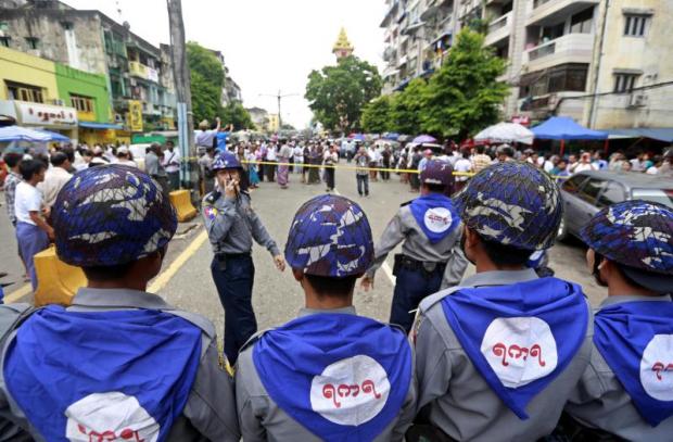 Myanmar riot police block the road during a protest in downtown Yangon, on Tuesday [phot credit: EPA]