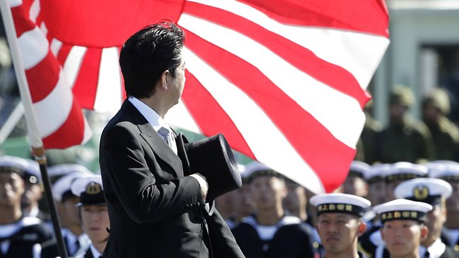 Japanese Prime Minister Shinzo Abe reviews members of Japan Self-Defense Forces (SDF) during the Self-Defense Forces Day at Asaka Base, north of Tokyo, Sunday, Oct. 27, 2013 [photo credit: AP]