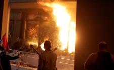 Protestors set fire to the Congress building during a demonstration against a possible change in the law to allow for presidential re-election (Photo credit: USA Today)