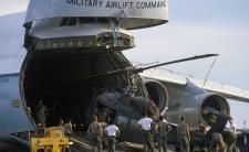 Air Force personnel load an Army UH-1H Iroquois helicopter into a 436th Military Airlift Wing C-5A Galaxy aircraft for transport to Ecuador (credit: Digital Public Library of America via Wikimedia Commons)