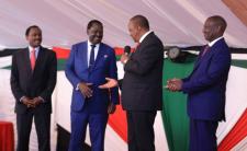 President Kenyatta (second right) and Odinga (second left) shake hands in presence of Vice President Ruto (right) (photo credit: Kenya Connection)
