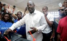 President Weah casts his vote ruing the runoff presidential election (photo credit: Thierry Gougnon/Reuters)