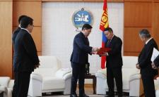President of Mongolia - second from right - receives proposed constitutional amendments from speaker - second from left (photo credit: Montsame)