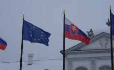Slovak flag and European Union flag under the rain (credit: Kiwiev via Wikimedia Commons)