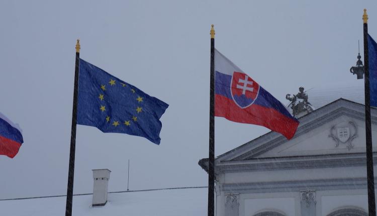 Slovak flag and European Union flag under the rain (credit: Kiwiev via Wikimedia Commons)