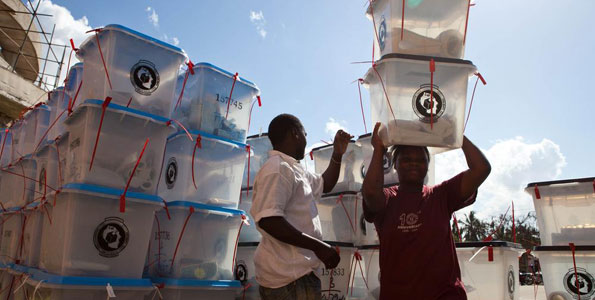 Election officials collect ballot boxes - Tanzanians will go to the polls on October 25, 2015 to elect a new president (photo credit: AFP)
