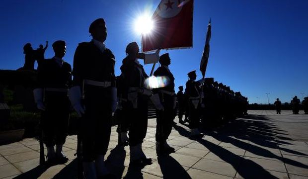 Tunisian military band members perform during a symbolic funeral for soldiers killed by terrorists. Photo//Fethi Belaid