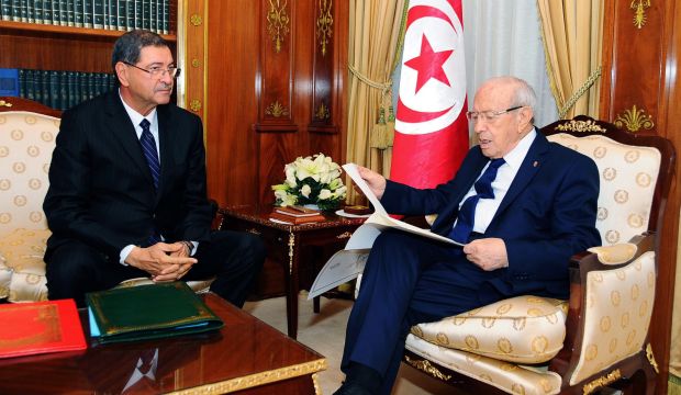 Tunisian President Beji Caid El-Sebsi meets the new Tunisian Prime Minister designate, Habib Essid, at the Presidential Palace, Carthage, Tunisia, on January 23, 2015. (EPA/STR)
