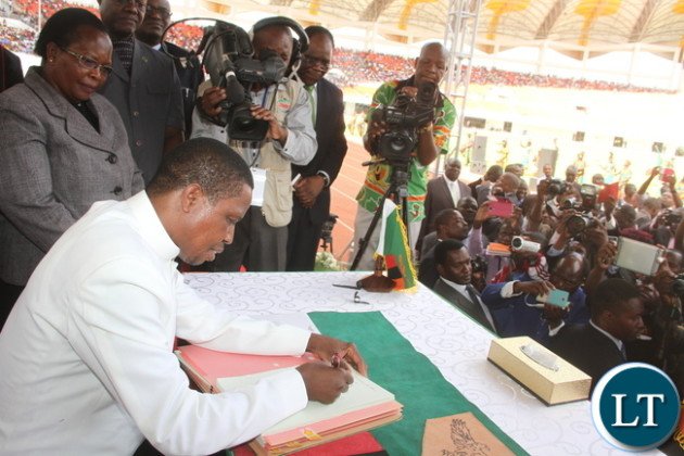 President Lungu signs the Constitutional Amendment Bill on Tuesday, January 5,2016 (photo credit: Thomas Nsama) 